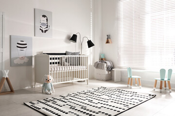 Cute baby room interior with crib and decor elements