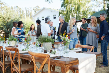 Group of friends enjoying cocktails at an outdoor party