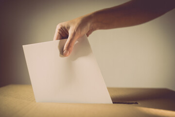 Conceptual image of a person voting during elections