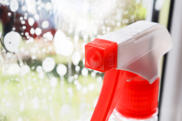 window cleaner close-up on the background of the window. selective focus, Spring cleanup, housework concept, Washing Window
