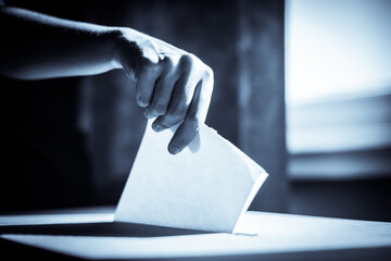 Conceptual image of a person voting during elections