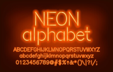 Neon alphabet font. Yellow neon light uppercase and lowercase letters and numbers. Blurred background. Stock vector typescript for your design.