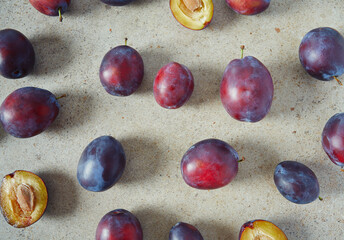 fresh plums on granite surface