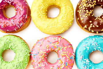 Various glazed sweet donuts top view