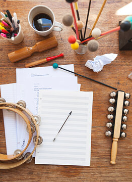 Overhead view of a music teacher's desk with random instruments
