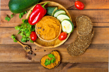 squash caviar on a wooden table, preparation and ingredients