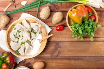 dumplings with potatoes on a wooden table