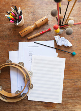 Overhead view of a music teacher's desk with random instruments