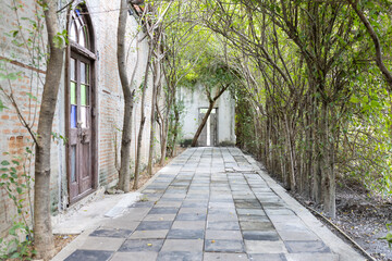 exterior view of brick walkway at historic backyard and garden