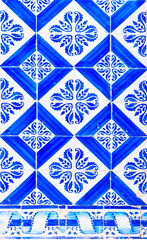 Detail of the traditional tiles from facade of old house. Decorative tiles.Portuguese traditional tiles. Floral ornament.