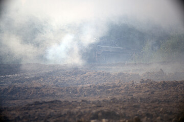 A smoke bomb on the battlefield. Smoke bombs action.