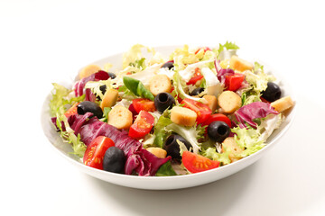 vegetable salad with tomato, olive and crouton isolated on white background