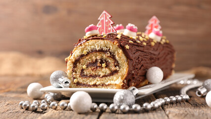 christmas chocolate swiss roll and decoration- chocolate yule log christmas cake