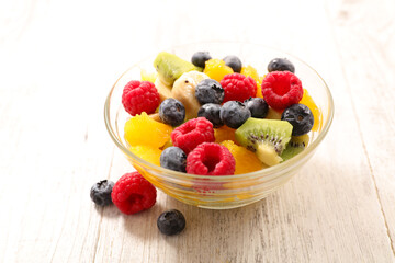 mixed fruit salad with blueberry, raspberry, kiwi, banana and orange