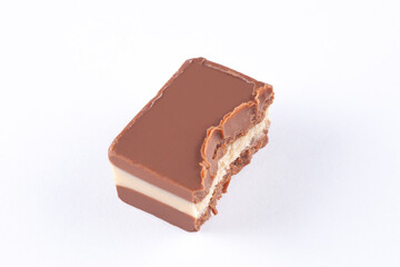 half bitten chocolate candy isolated on white background with copy space for your text