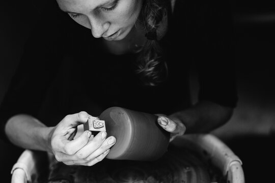 Woman making pottery in her studio