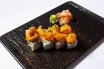 Yuzu prawns sushi roll served on black stone
