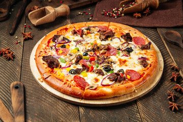 Assorted beef pizza with salami and vegetables