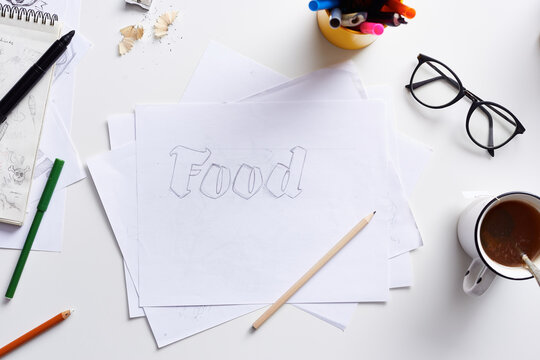 Food word in pencil on paper.