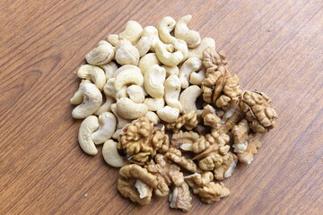 Cashew Nut and walnut on wood