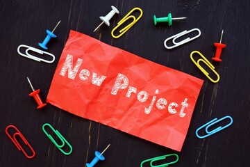 Business concept meaning New Project with inscription on the sheet.