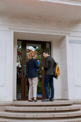 Business people entering modern office building in the morning