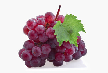 Ripe red grapes with leaves isolated