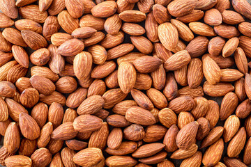 Tasty dry almond nuts background
