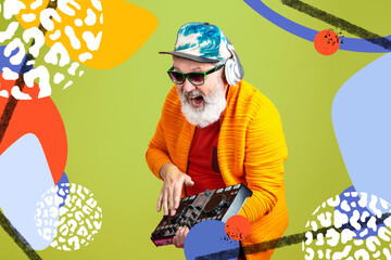 Forever young. Portrait of senior hipster man using devices, gadgets isolated on orange studio...