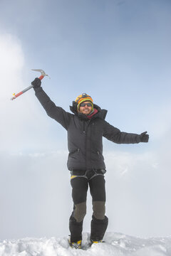 Mountain Climber reaching the summit