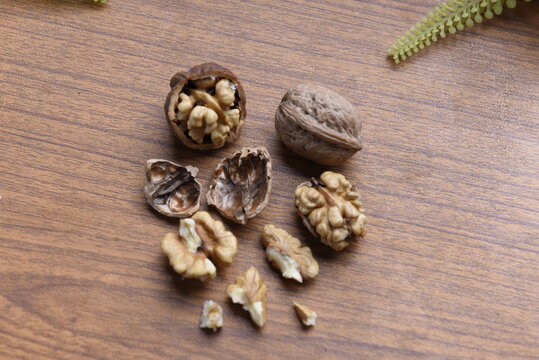 dry walnut shells on wooden table