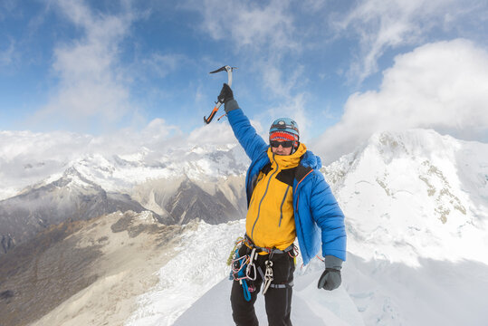 Male Alpinist Portrait on mountain summit