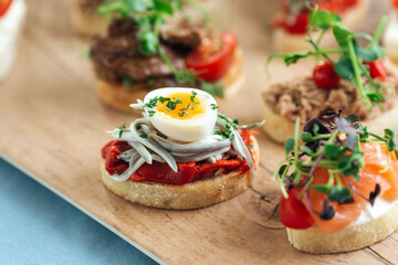 Closeup on assorted tappas with different toppings