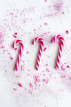 three xmas candy canes with crushed sprinkles