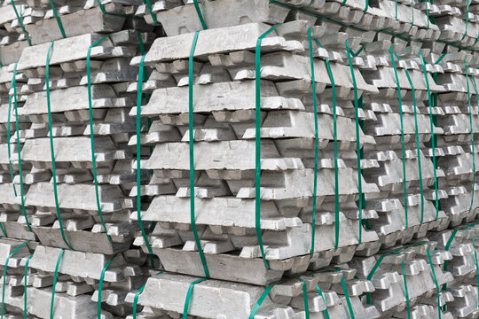 Stacked alumninium ingots in warehouse awaiting delivery
