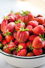 Fresh strawberries in a bowl.  Ingredient for smoothies.