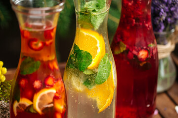Three fruit and berry lemonades on the wooden tray