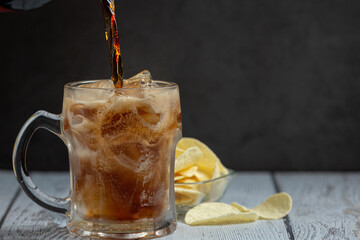 Beautiful cold drink of cola with Ice cubes