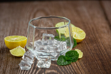 A glass with ice is placed on the table.