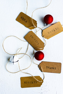 xmas tags with words symbolising actions other than gift giving
