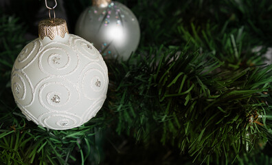 shiny white ball on christmas tree.Christmas card with decorated element.Christmas concept.