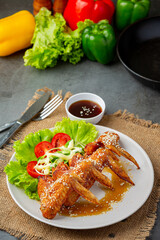 Fried chicken wings with fish sauce and sweet fish sauce.