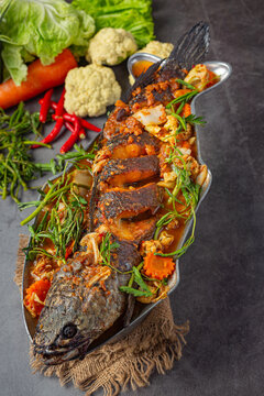 Sour curry with snakehead fish, spicy garden hot pot, Thai food.
