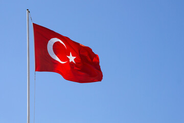 blue sky and the turkish flag waving in the wind
