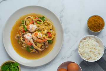 Stir-fried with mixed seafood, served with steamed rice, Thai food.
