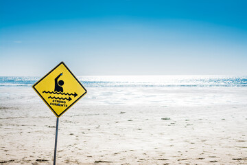 Strong Currents sign at Piha beach, New Zealand