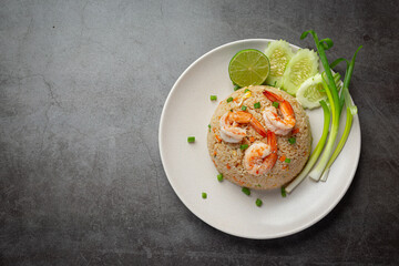 Fototapeta na wymiar American Shrimp Fried Rice served with Chili Fish Sauce Thai Food.