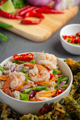 Spicy crispy morning glory salad with shrimp, spicy fresh shrimp, Thai food.