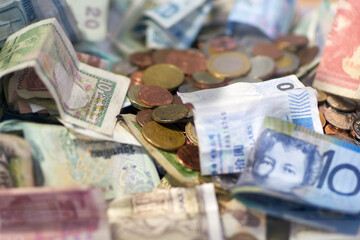 Pile of coins and bank notes