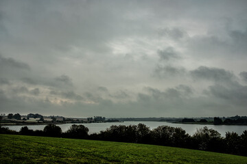 bleak clouds over the river